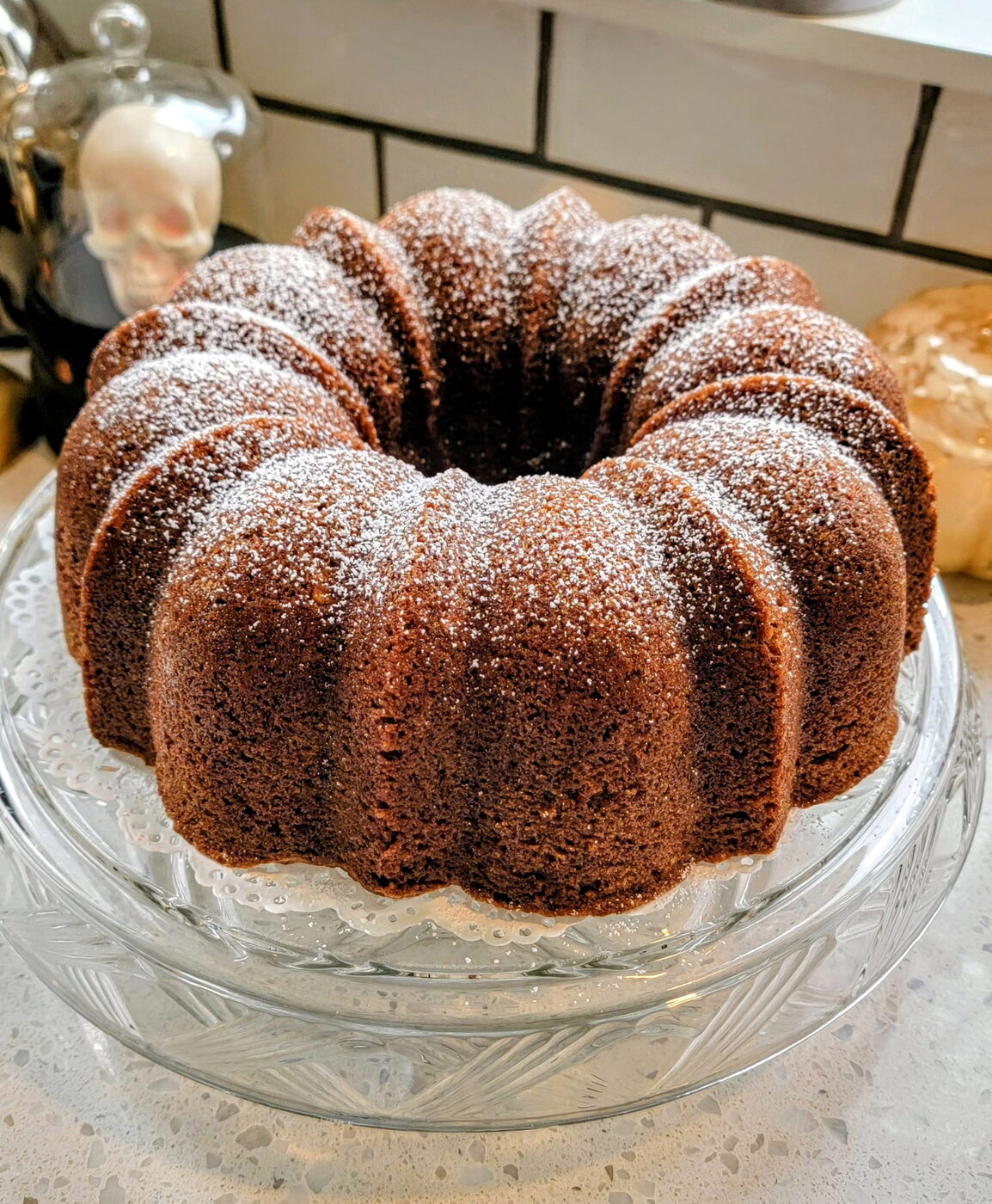 Baked cake in its pan on a cooling rack